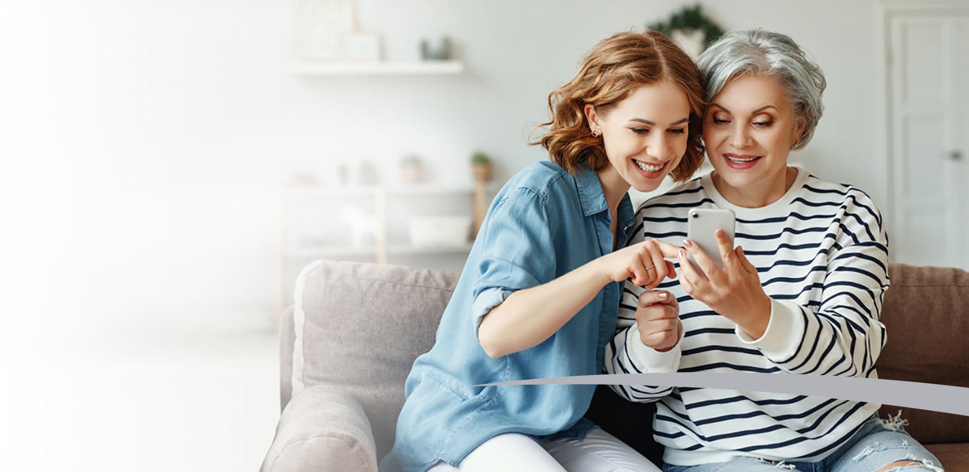 older mother and daughter using smart phone