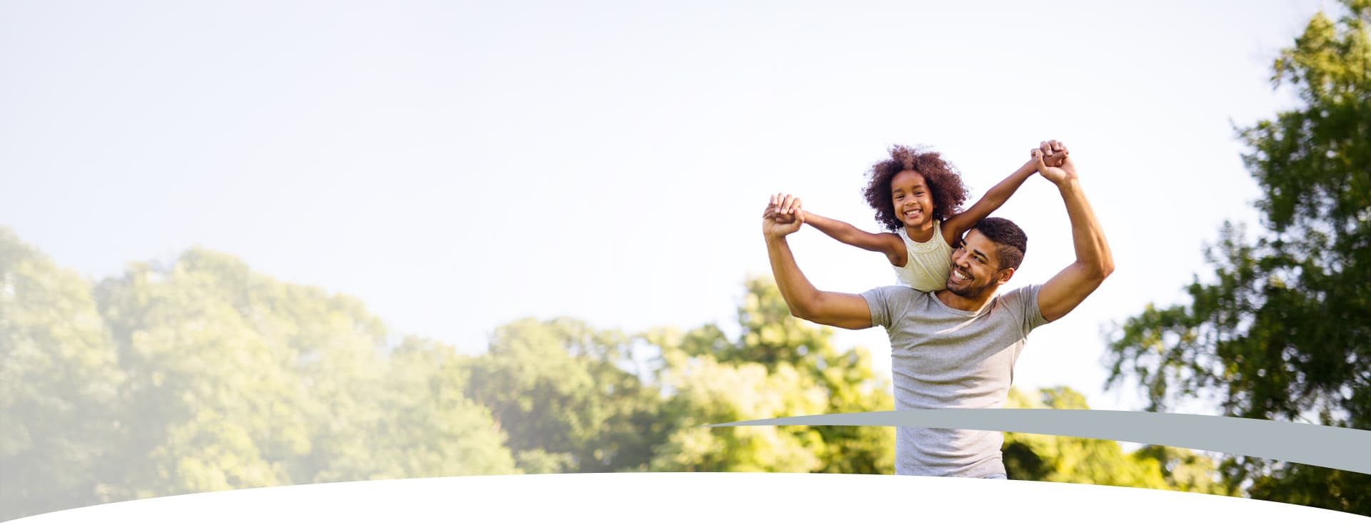 father with daughter on shoulders