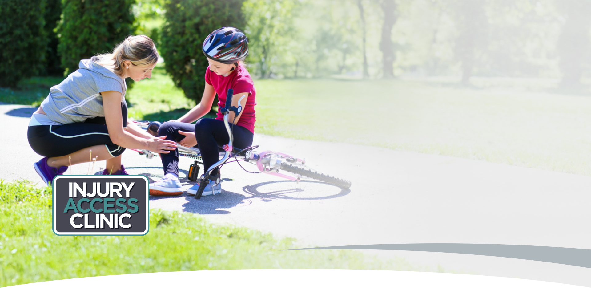 Photo: Mom checks daughter's injured leg after a bike fall