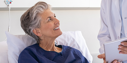 Photo: Woman being comforted by doctor